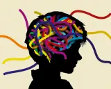 Bunte Stränge im Kopf eines Kindes symbolisieren Gedanken. Eine Alternative zu Ritalin für Kinder könnte hier gesucht werden.